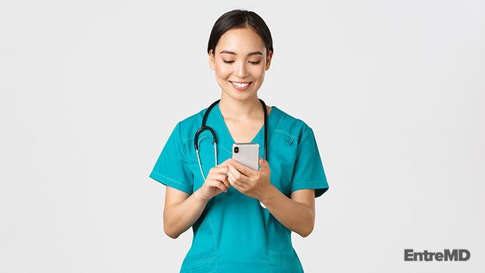 Doctor Holding Mobile Phone