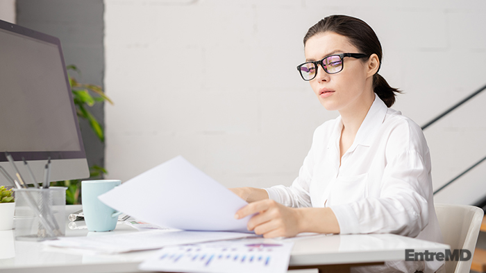 Doctor Handling Paperwork