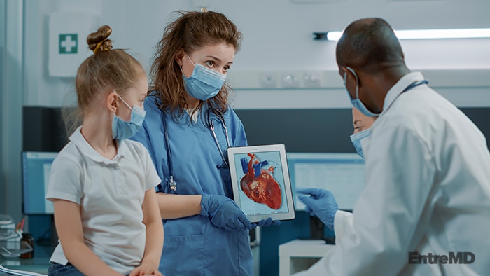 Medical Specialists With a Patient